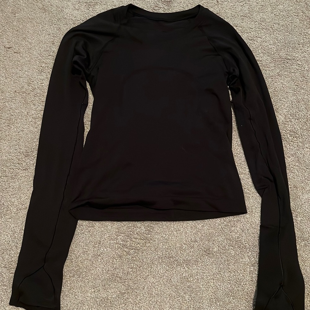 size 2 lightly worn swiftly tech small rip in elbow